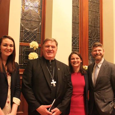 Cardinal Tobin poses for a photo with some young adults who attended the benefit evening. (Photo: Samantha Lin)
